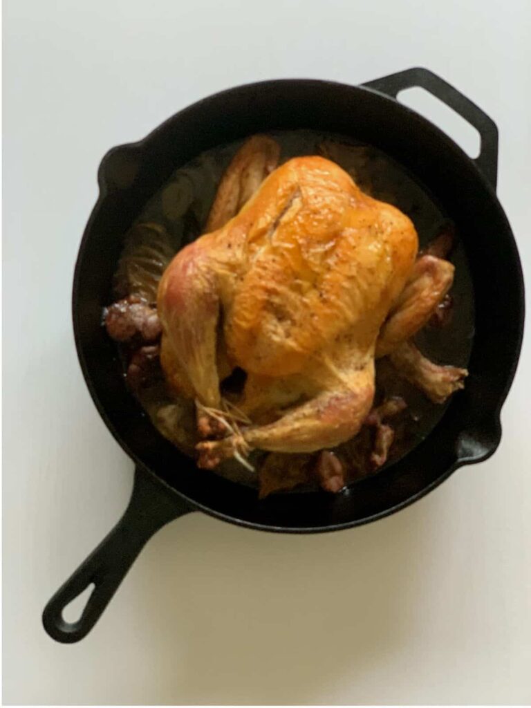 Overhead shot of Crispy Roasted Chicken in a Cast Iron Skillet
